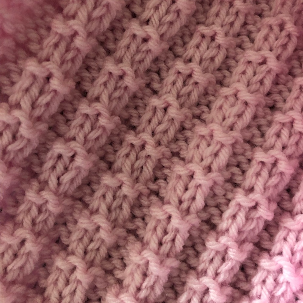 Pink knitted scarf